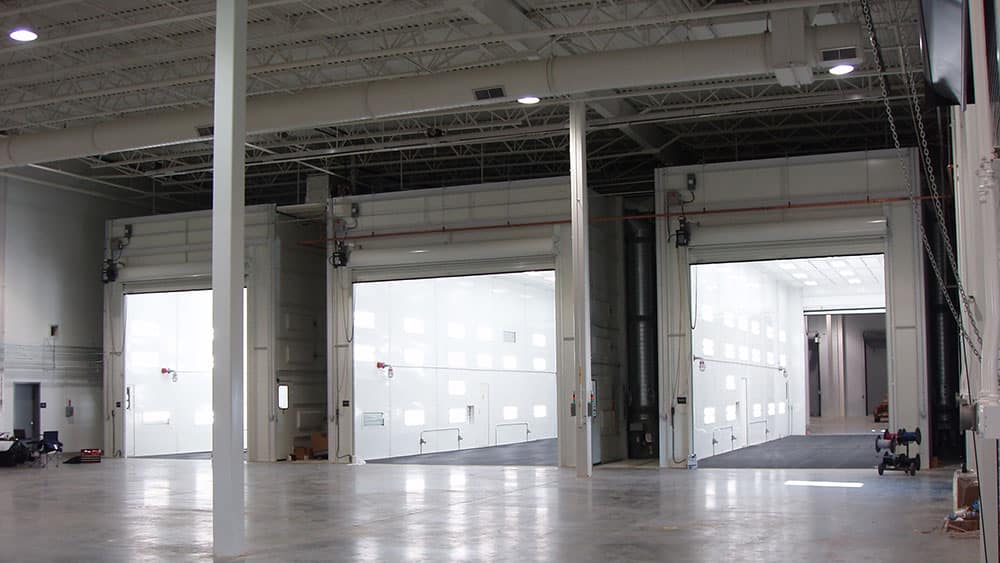 Three industrial drive thru spray booths