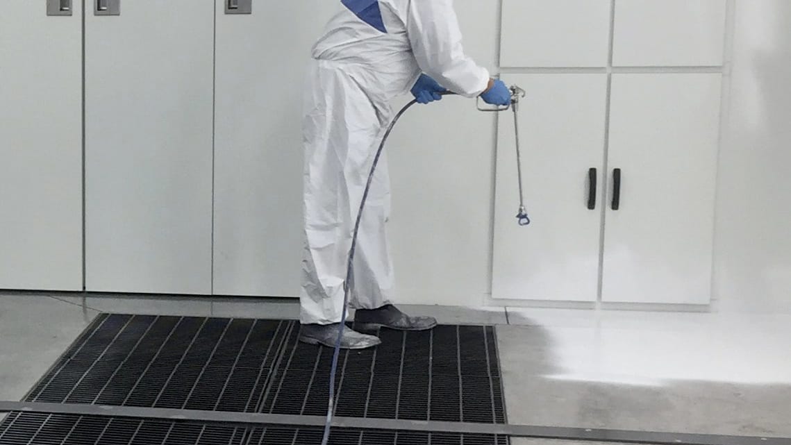 Applying Booth Shield in paint booth