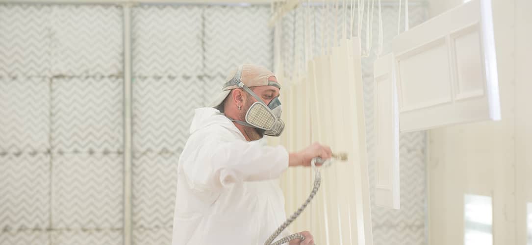 Spraying in a woodworking paint booth