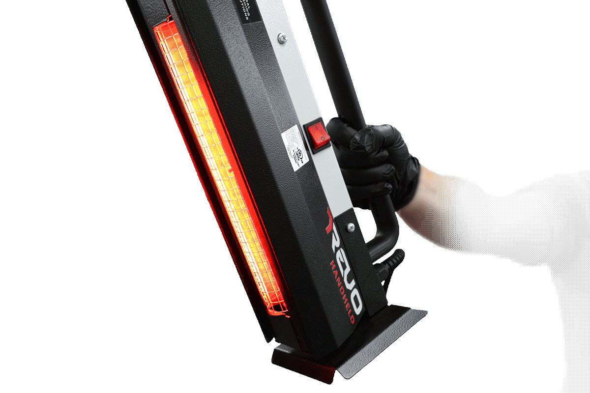 Technician holding GFS REVO Handheld unit