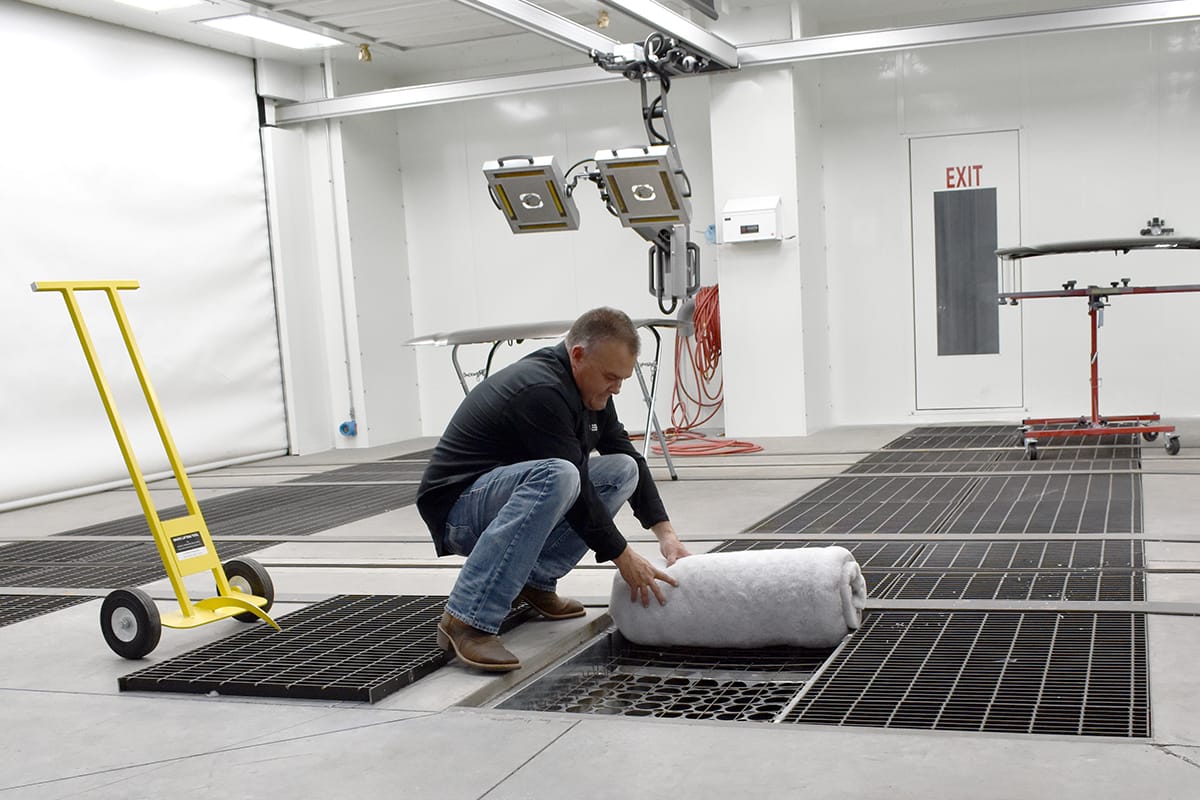 GFS Service Technician installing paint booth filters