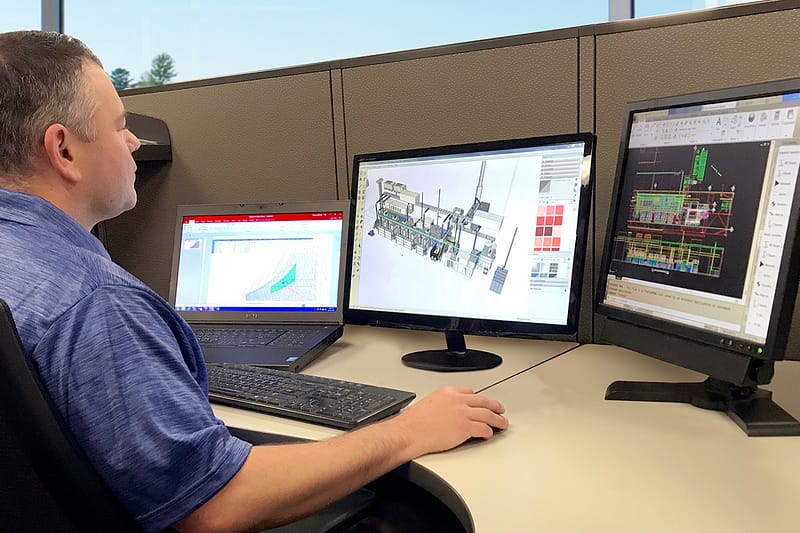 GFS Engineer working on plans for large paint booth installation
