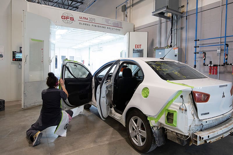 Car being tapped for painting in a GFS Ultra XP1 paint booth