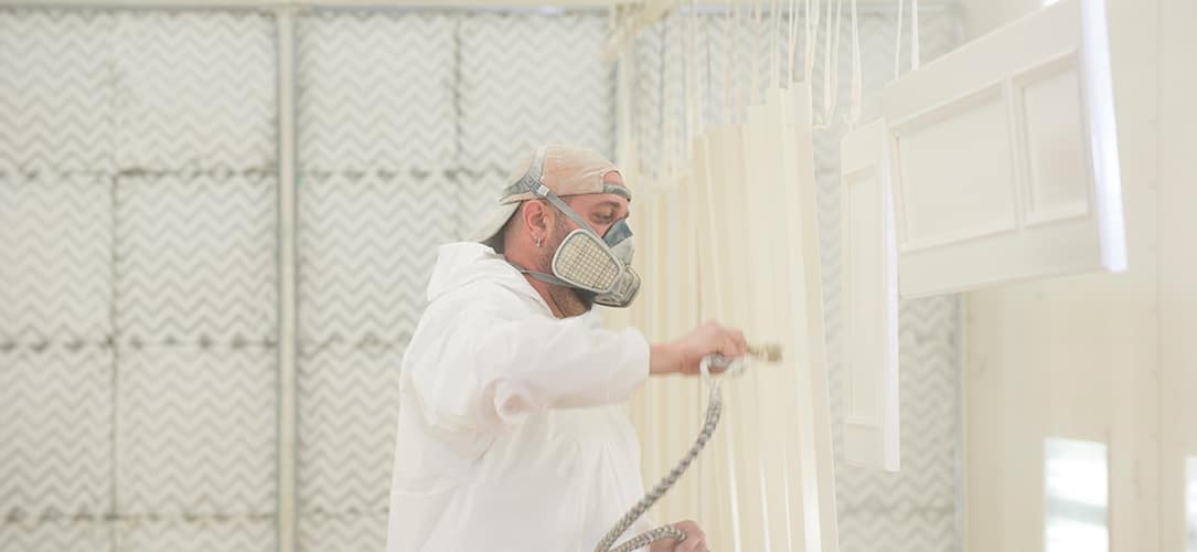Spraying in a woodworking paint booth