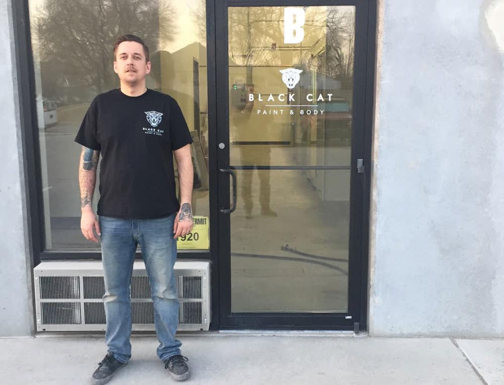 Brad in front of Black Cat Paint and Body